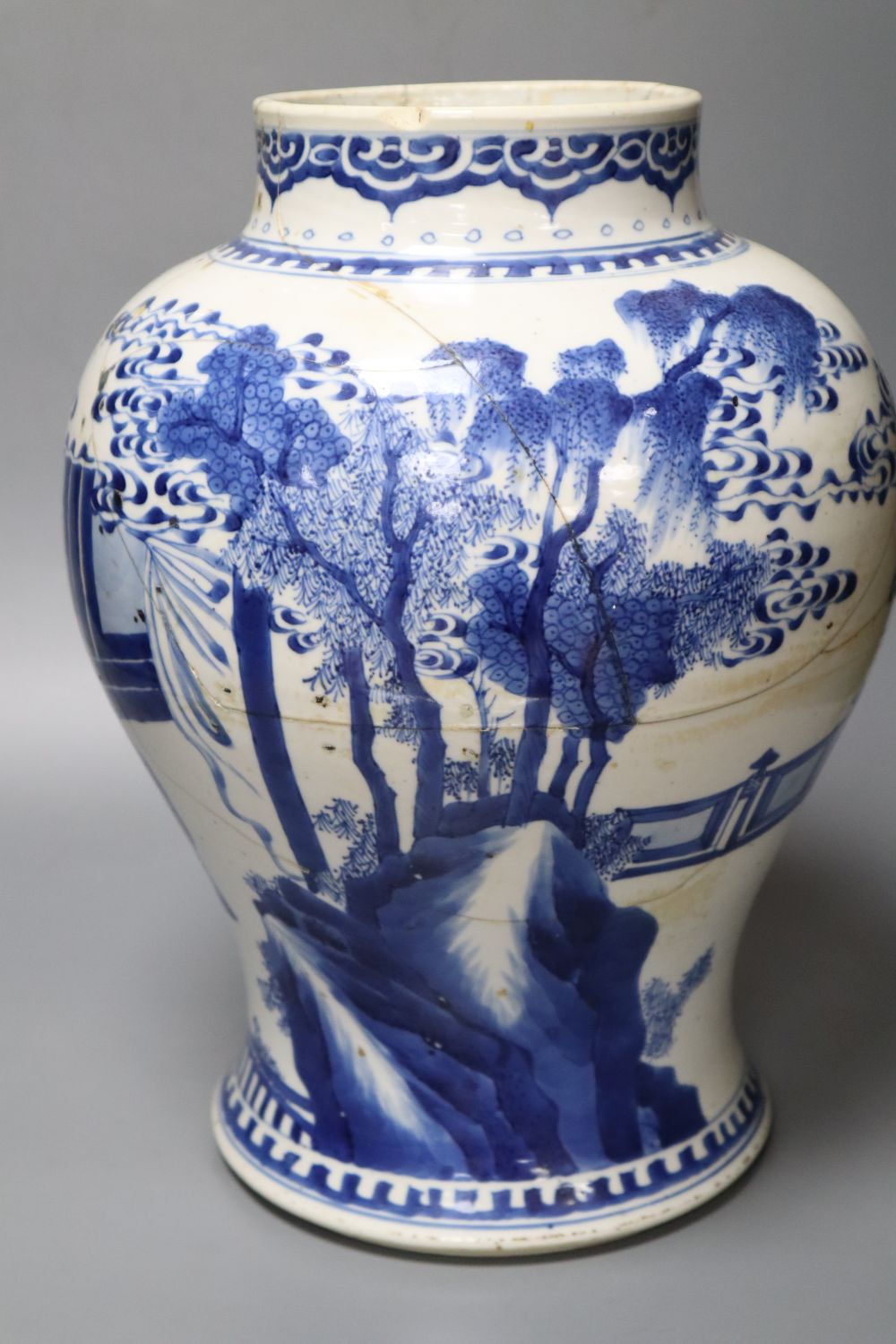 A Chinese Kangxi period blue and white baluster vase, repaired, 35cm